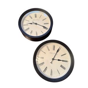 2 Arbor & Emery round black clocks - Roman numerals - plastic - pair